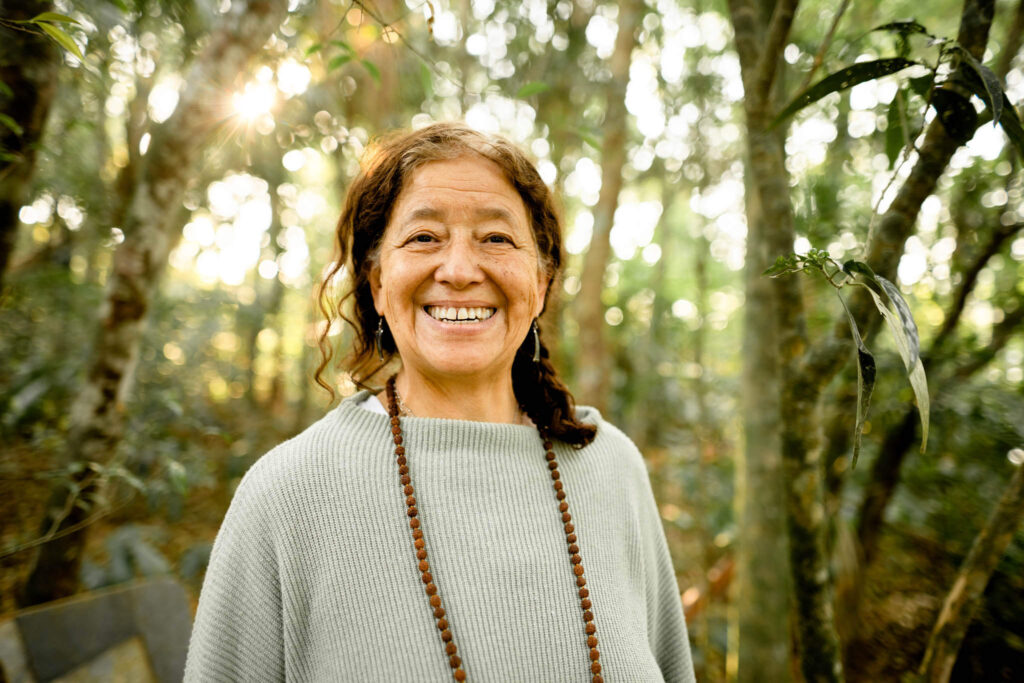 EP Carbon Woman Smiling in Carbon Offset Project Forest